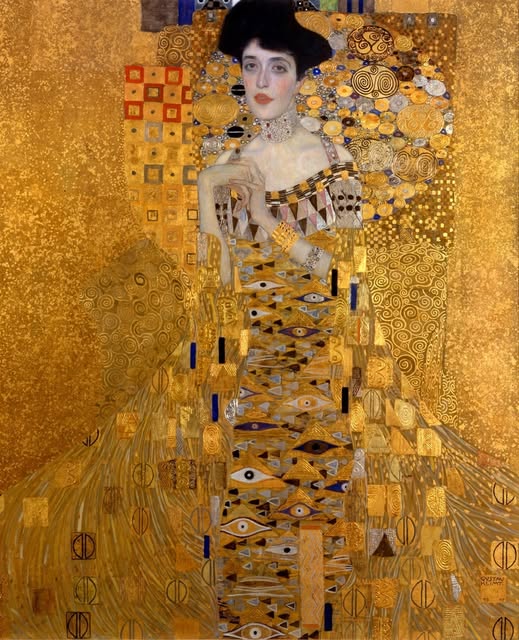 A portrait surrounded by gold and intricate geometric patterns